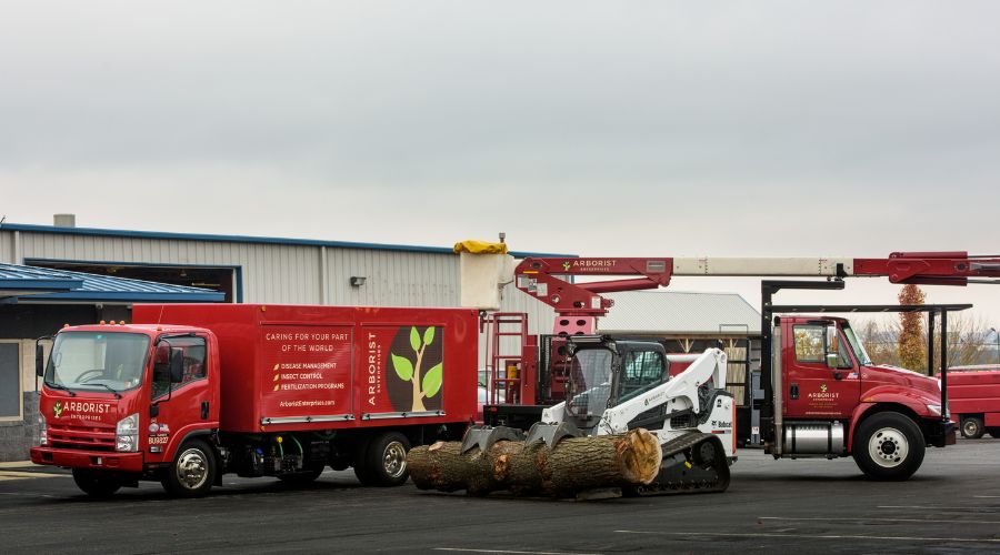 The Arborist Enterprises grapple carrying a log after a tree removal in Manheim, PA.