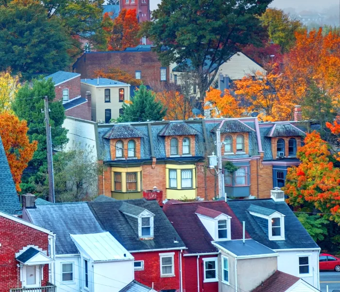Colorful houses and trees in Lancaster, PA during fall season.
