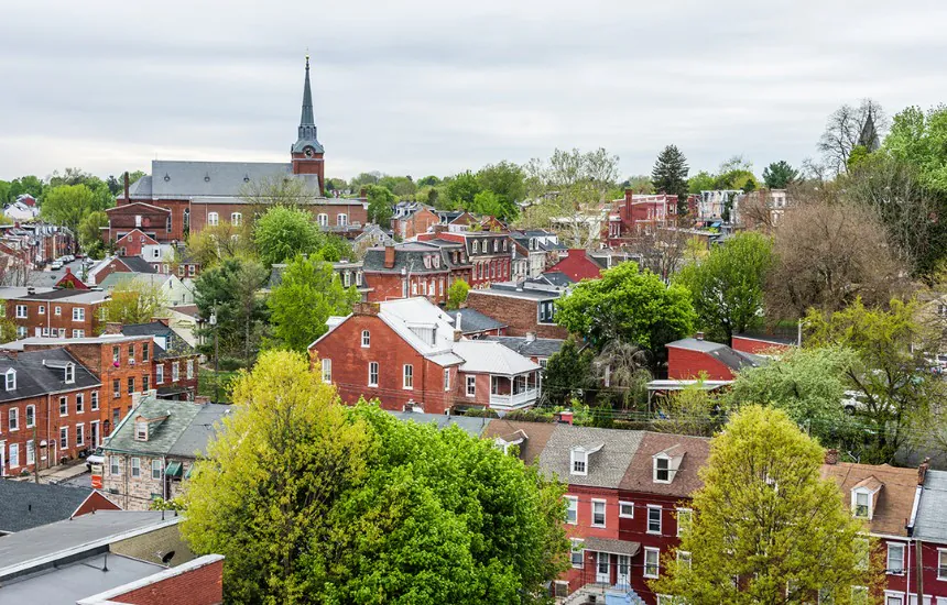 Residential houses surrounded by trees and church center in Redrose City, Lancaster, PA