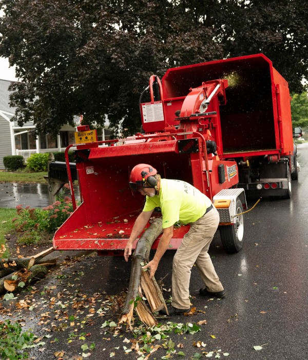 Ground crew feeding branches to a chipper after an storm clean up near Lititz, PA