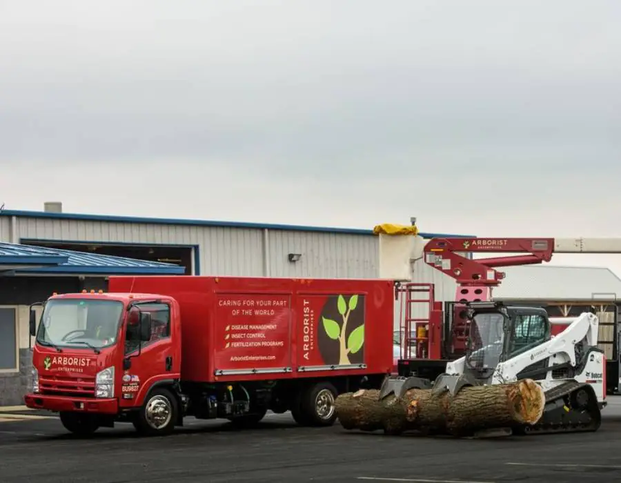 Arborist enterprises truck and heavy equipment.